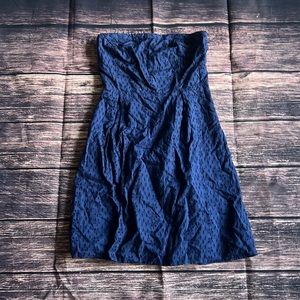 Navy blue tube top dress with side zipper closure. Size 6